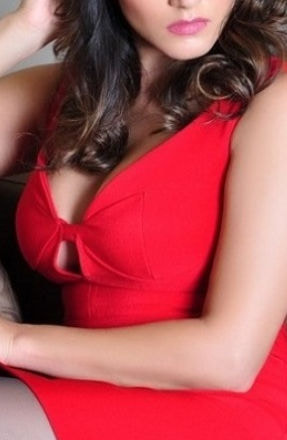Busty Indian brunette in a short, red dress
